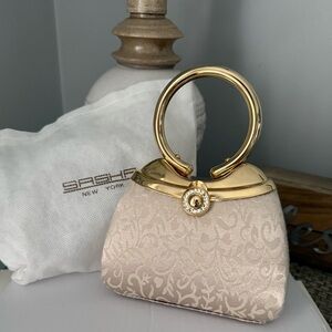 Gold and Cream Handbag Make a real statement with this clutch.